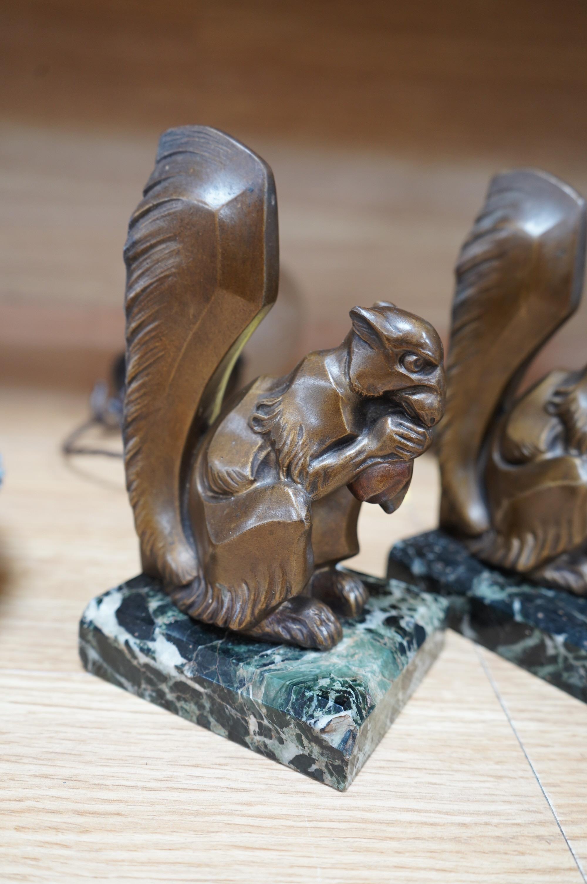 A pair of French Art Deco spelter squirrel bookends, on marble plinths, 18cm high. Condition - fair to good